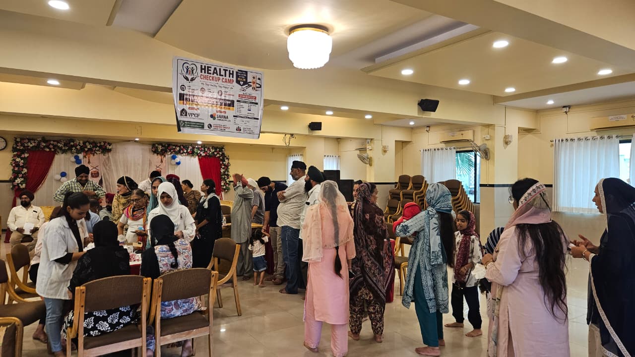 Busy blood testing and medical consultation area at the Health Checkup Camp in Vapi